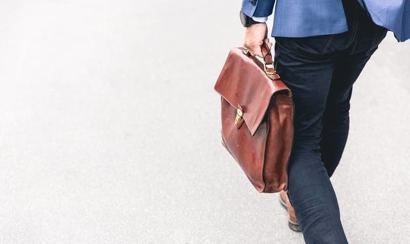 Self-employed businessman carrying a brief case. Business protection advice from ME FInancial Services Ltd, UK